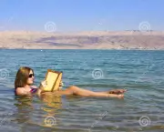 http://www.dreamstime.com/stock-photos-young-girl-reads-book-floating-dead-sea-israel-beautiful-woman-waters-image53317193